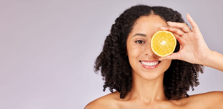 Face portrait, skincare and black woman with lemon in studio isolated on a gray background mock up. Nutrition, cosmetics and happy female model with fruit food for vitamin c, diet or healthy skin