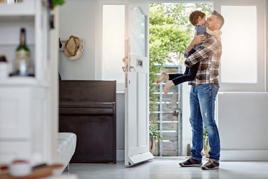 Happy family, love and father hug son, happy and excited to return home, hello and bond. Happy family, greeting and child embrace parent at front door, coming home and content, happiness and playful.