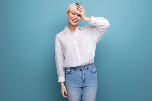 young pretty smart blond female student dressed in a white blouse. people lifestyle concept.