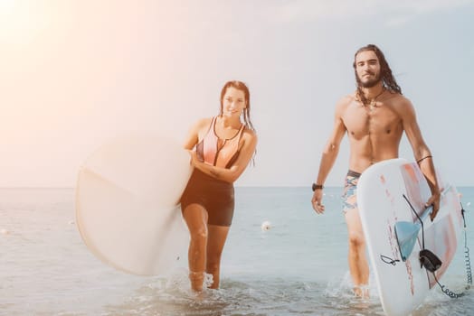 Woman man sea sup. Close up portrait of beautiful young caucasian woman with black hair and freckles looking at camera and smiling. Cute woman portrait in a pink bikini posing on sup board in the sea