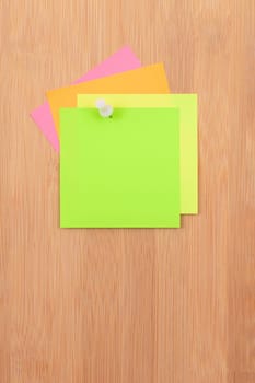 Colored Sticky Notes with Copyspace Pinned to the Wooden Message Board. To Do List Reminder in Office. Blank Memo Sticker at Work - Template. Empty Checklist - Mockup