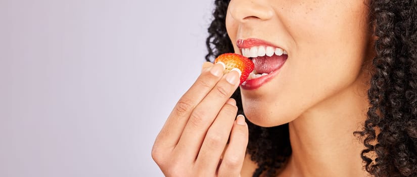 Mockup, strawberry and mouth with a black woman eating in studio on a gray background to promote health. Food, fruit and beauty with a female biting a berry on blank mock up space for a wellness diet.