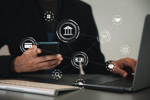 Close-up of a hand holding a credit card and smartphone. Man and woman shopping online together. Digital payment and e-commerce concept