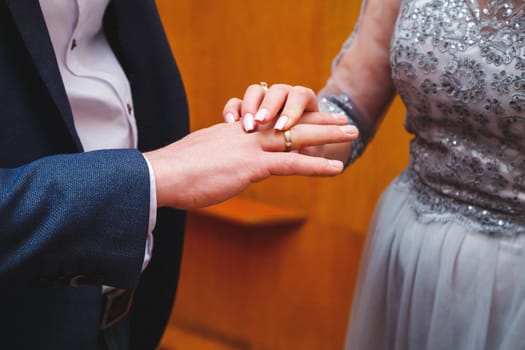 Golden wedding rings for newlyweds on their wedding day