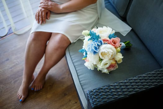 Beautiful bride in a white coat on a wedding day