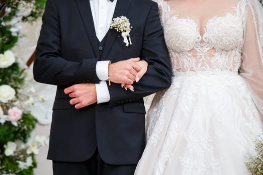 Newlyweds on wedding day, wedding couple holding hands, bride and groom