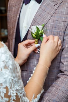 Bride cuddle with groom on wedding day