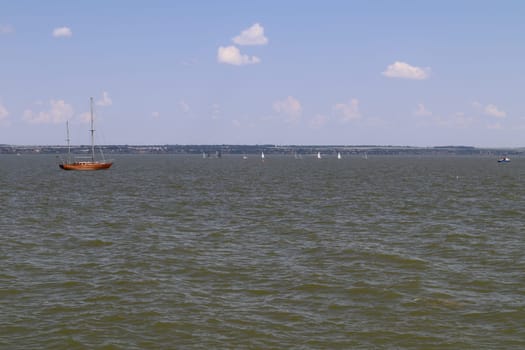 yachts on the water against the blue sky. photo