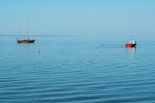 yachts on the water against the blue sky. photo