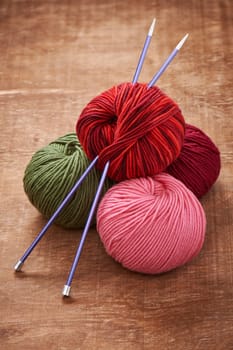 Pile skeins of yarn and knitting needles