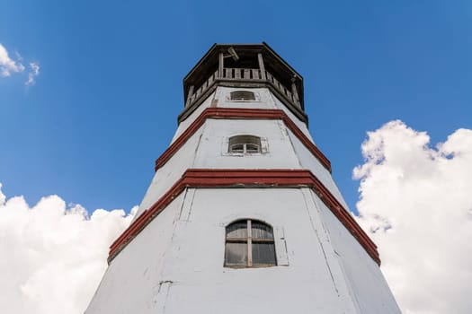 the old lighthouse against the blue sky. photo