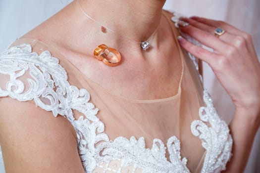 Golden wedding rings for newlyweds on their wedding day