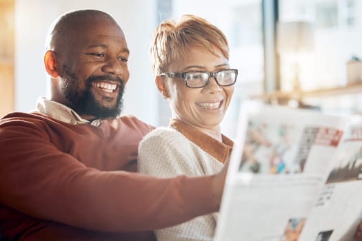 Happy black couple, reading newspaper or magazine in home sofa while relax, for news in living or furniture idea. Love, smile or woman and man happiness in house for bonding, family time or romance.