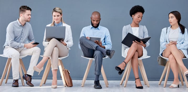 Technology, recruitment and a group of business people waiting in line for their meeting with human resources. Interview, hiring or diversity with man and woman candidates sitting in a row at hr.