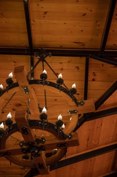 Medieval chandelier with burnt out candlesin medieval style, Closeup.