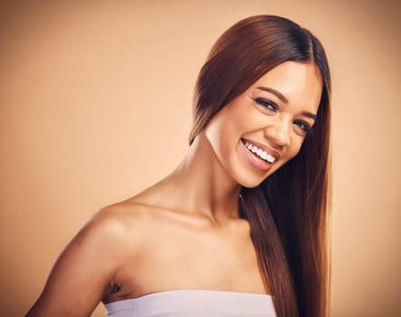 Happy, hair and portrait of woman with beauty in studio for wellness, keratin treatment and haircare. Salon, hairdresser and face of female person on orange background for growth, shine and texture.