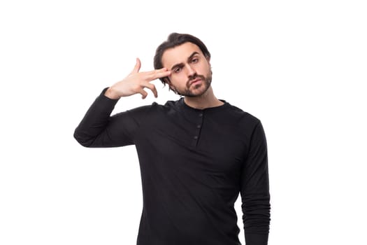 close-up portrait of a young 30 year old doubting bearded well-groomed brunette with a chic stylish hairstyle.