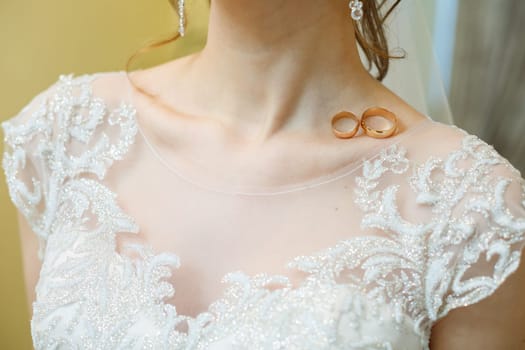 Golden wedding rings for newlyweds on their wedding day