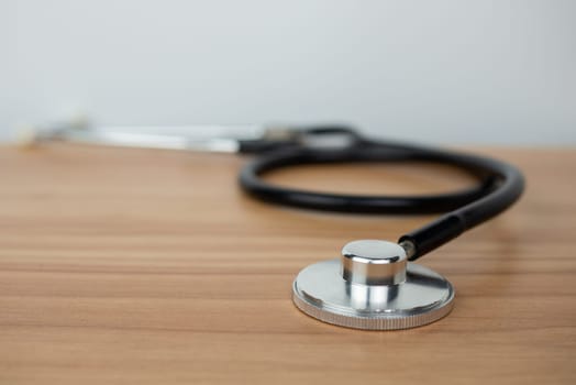 Stethoscope placed on a wooden floor. Medical concept. health concept