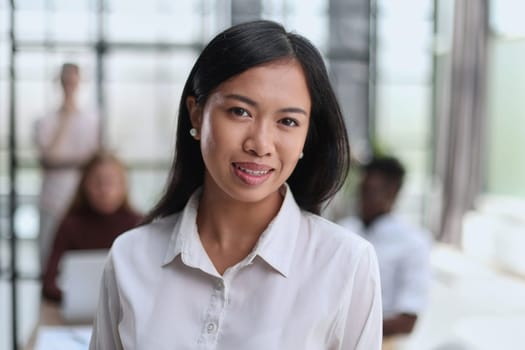 Young beautiful Asian business woman consultant working in the office,