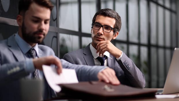 mate sitting at table talking working on common project, company representative and client discuss strategy