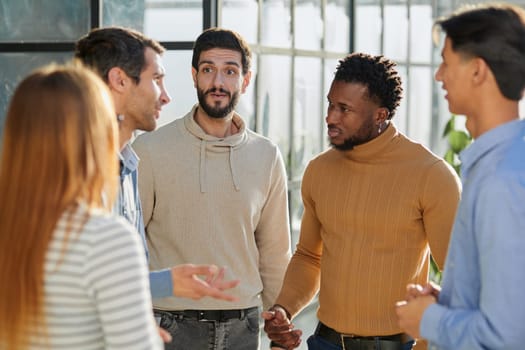 Group portrait of a professional business team having a discussion in the lobby of the office