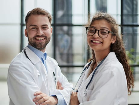 portrait of two medical workers in the hospital looking at the camera