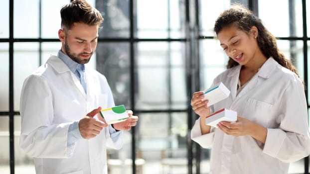 doctors read the dosage of the drug while standing in the lobby of the hospital