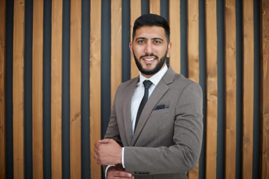 successful businessman on the background of a modern office.