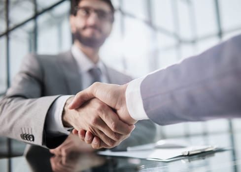 Handshake of two businessmen who enters into the contract to develop a new software