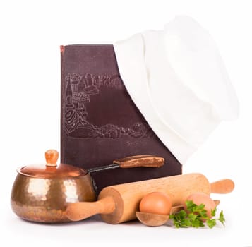 kitchen equipment - copper pan, rolling pin, spoons and different raw vegetables on a white background