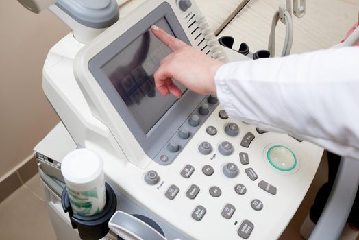 The doctor using the ultrasonography device, close view. High quality photo