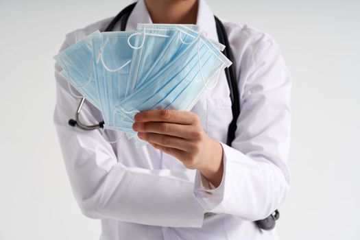Doctor or nurse recommend to use protective face mask to protect from virus infection