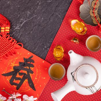 Design concept of Chinese lunar January new year - Festive accessories, red envelopes (ang pow, hong bao), top view, flat lay, overhead above. The word 'chun' means coming spring.