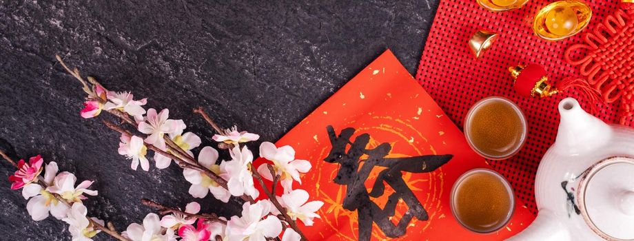 Design concept of Chinese lunar January new year - Festive accessories, red envelopes (ang pow, hong bao), top view, flat lay, overhead above. The word 'chun' means coming spring.