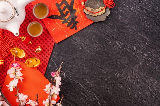 Design concept of Chinese lunar January new year - Festive accessories, red envelopes (ang pow, hong bao), top view, flat lay, overhead above. The word 'chun' means coming spring.