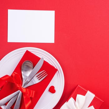 Valentine's Day meal design concept - Romantic plate dish set isolated on red background for restaurant, holiday celebration promotion, top view, flat lay.