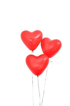 Red heart shaped helium balloon isolated on white background with ropes, Valentine's day, Mother's day, birthday party design concept. Clipping path.