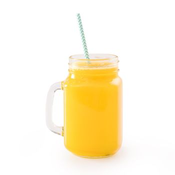 Fresh tropical mango juice with beautiful diced fruit flesh, striped paper straw isolated on white background table, close up, cut out, clipping path.