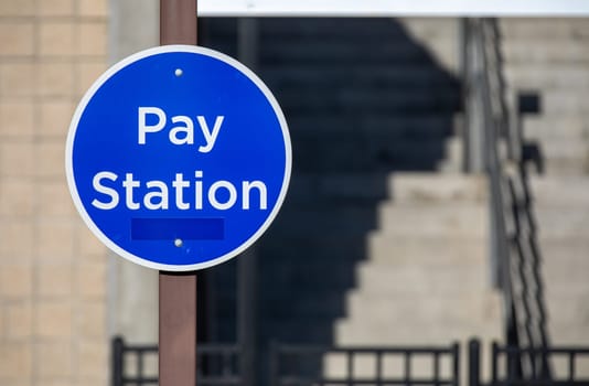 blue pay station sign to enter an area
