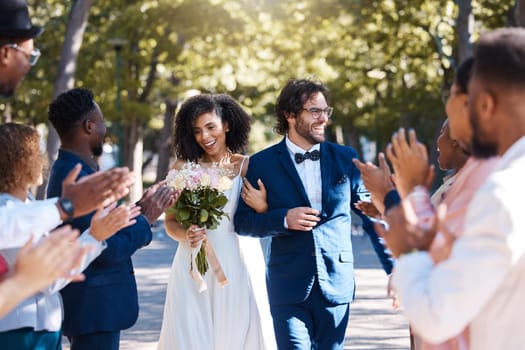 Happy celebration and clapping for couple at wedding with excited, joyful and cheerful crowd of guests. Interracial love and partnership of people at marriage event with applause and smile.