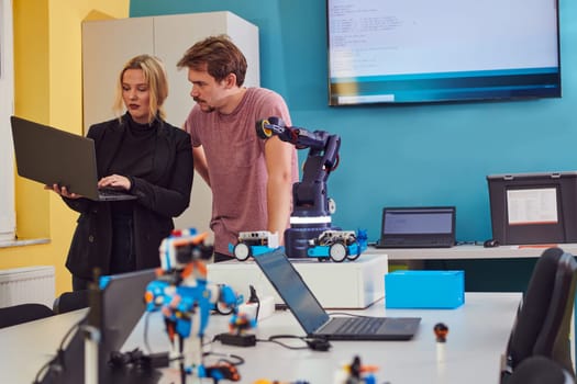 A group of colleagues working together in a robotics laboratory, focusing on the intricate fields of robotics and 3D printing. Showcase their dedication to innovation, as they engage in research, development, engineering, and precision work.