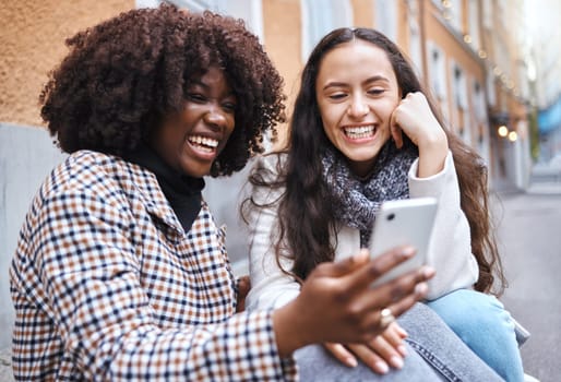 Friends, city and women with phone for social media, conversation and connection on London street. Communication, internet and happy black woman and girl on smartphone smile for selfie, app and meme.