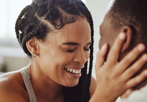 Black couple, face and laugh in bedroom, romance and morning for bonding, care and romance in home. Happy couple, smile and touch for happiness, holiday or vacation in hotel room, apartment and relax.