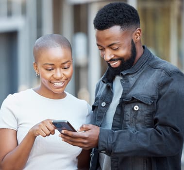 City, communication and couple browsing on a cellphone with social media, mobile app or the internet. Technology, 5g network and young African man and woman scrolling on a website with phone in town