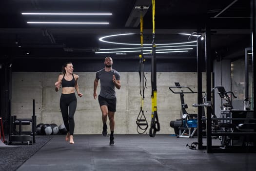 A fit couple in a modern gym, engaging in running exercises and showcasing their athletic prowess with a dynamic start