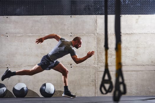 A muscular man captured in air as he jumps in a modern gym, showcasing his athleticism, power, and determination through a highintensity fitness routine.