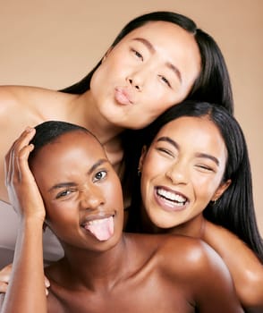 Diversity, beauty and women in crazy portrait smile together, skincare friends on studio background. Health, wellness and luxury cosmetics for beautiful multicultural people in makeup with tongue out.