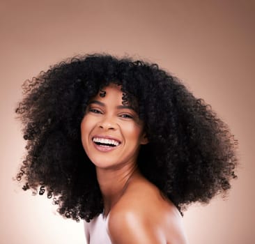 Smile, hair and beauty portrait of black woman on brown background for wellness, shine and natural glow. Salon, luxury treatment and happy girl face with curly hairstyle, texture and afro growth.