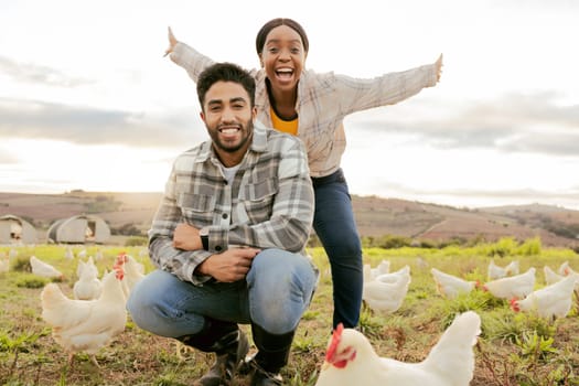 Poultry, chicken and couple farming, freedom with livestock on agriculture land, field and nature portrait. Farmer, animal with man and woman on farm, chicken farm and sustainable in the countryside